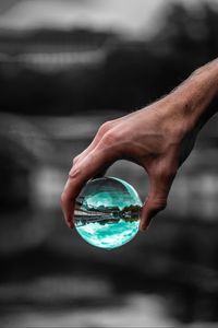 Preview wallpaper ball, glass, hand, transparent, reflection