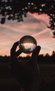 Preview wallpaper ball, glass, hand, sunset, transparent