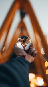 Preview wallpaper ball, glass, hand, reflection, blur