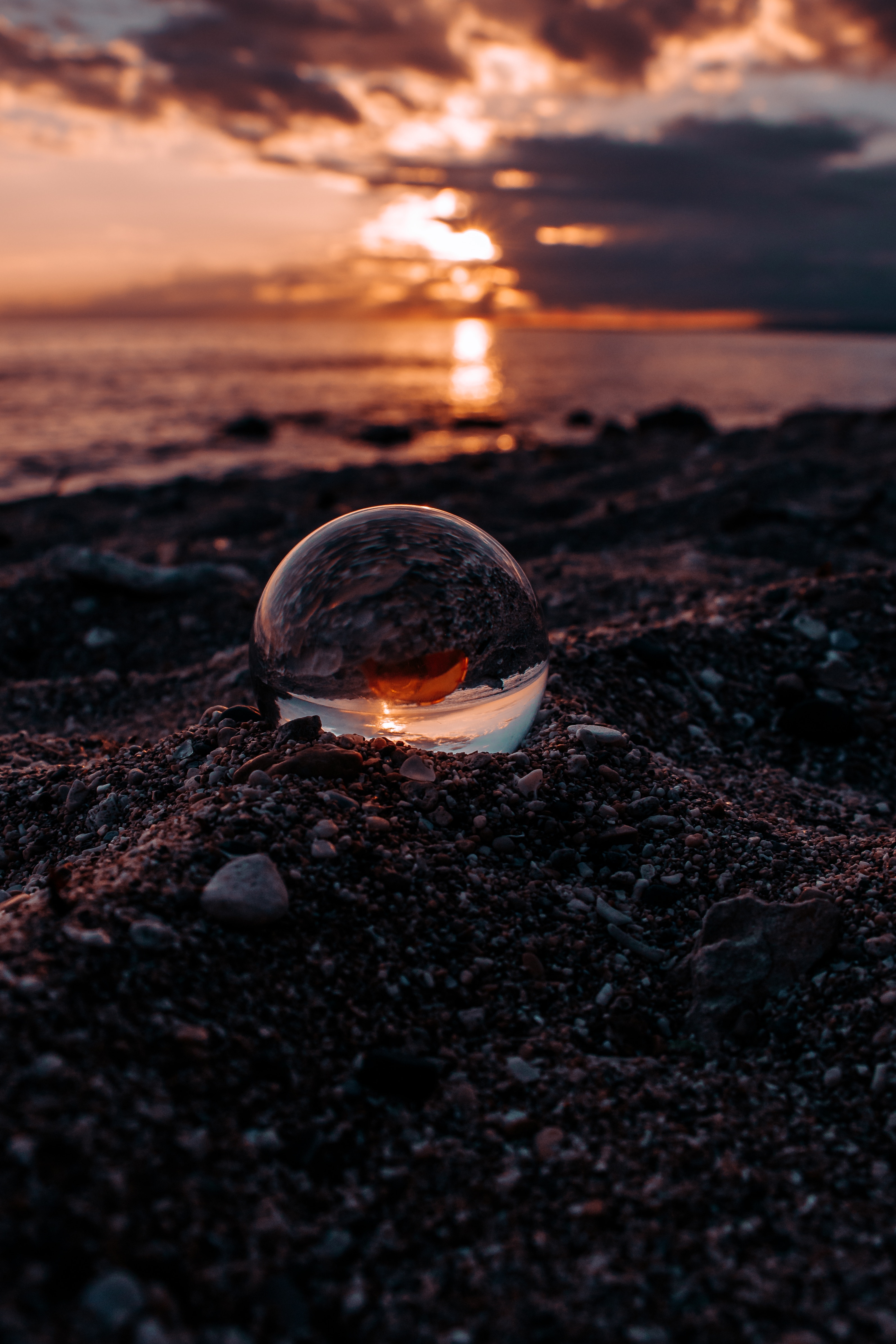 Download wallpaper 3187x4780 ball, glass, macro, sunset, blur hd background