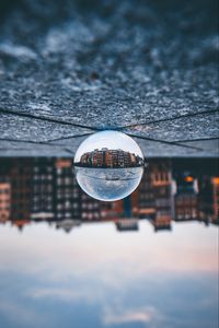 Preview wallpaper ball, glass, reflection, building, blur