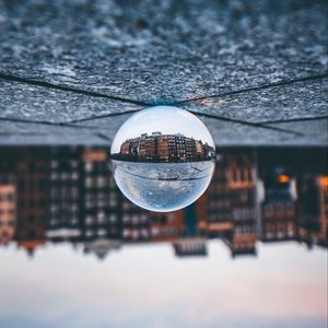 Preview wallpaper ball, glass, reflection, building, blur