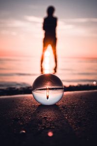 Preview wallpaper ball, glass, reflection, silhouette