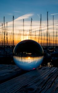 Preview wallpaper ball, glass, reflection, sunset, pier