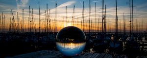 Preview wallpaper ball, glass, reflection, sunset, pier