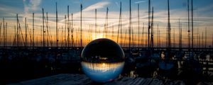 Preview wallpaper ball, glass, reflection, sunset, pier