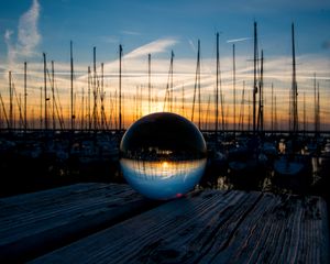 Preview wallpaper ball, glass, reflection, sunset, pier