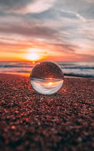 Preview wallpaper ball, glass, reflection, sea, sunset, shore