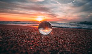 Preview wallpaper ball, glass, reflection, sea, sunset, shore