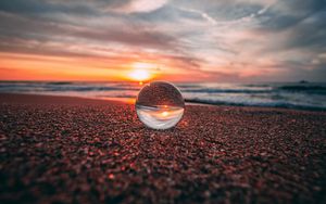 Preview wallpaper ball, glass, reflection, sea, sunset, shore