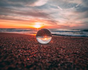 Preview wallpaper ball, glass, reflection, sea, sunset, shore