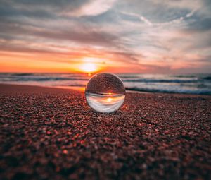 Preview wallpaper ball, glass, reflection, sea, sunset, shore