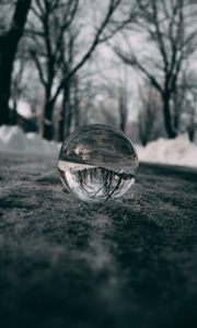 Preview wallpaper ball, glass, reflection, macro, blur, snow, trees