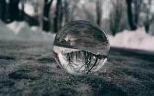 Preview wallpaper ball, glass, reflection, macro, blur, snow, trees