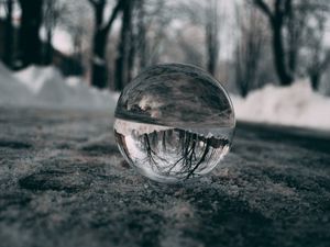 Preview wallpaper ball, glass, reflection, macro, blur, snow, trees