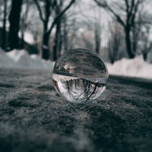 Preview wallpaper ball, glass, reflection, macro, blur, snow, trees