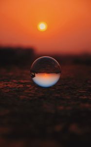 Preview wallpaper ball, glass, sunset, transparent, reflection, macro