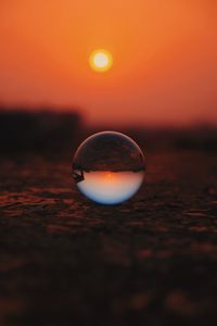 Preview wallpaper ball, glass, sunset, transparent, reflection, macro