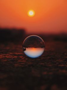 Preview wallpaper ball, glass, sunset, transparent, reflection, macro