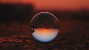 Preview wallpaper ball, glass, sunset, transparent, reflection, macro