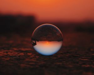 Preview wallpaper ball, glass, sunset, transparent, reflection, macro