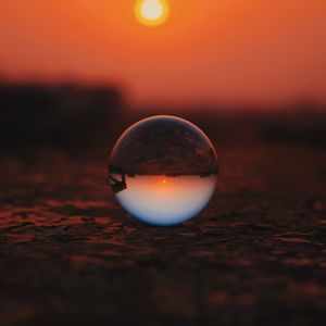 Preview wallpaper ball, glass, sunset, transparent, reflection, macro