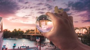 Preview wallpaper ball, hand, bridge, city