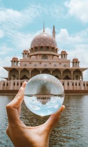 Preview wallpaper ball, hand, building, reflection, illusion