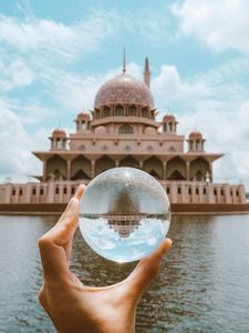 Preview wallpaper ball, hand, building, reflection, illusion