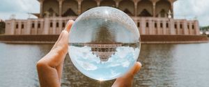 Preview wallpaper ball, hand, building, reflection, illusion