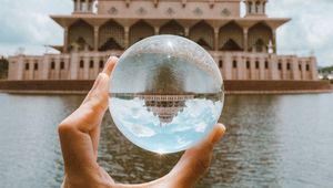 Preview wallpaper ball, hand, building, reflection, illusion