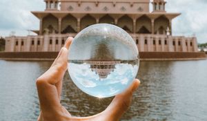 Preview wallpaper ball, hand, building, reflection, illusion