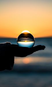 Preview wallpaper ball, hand, horizon, glass
