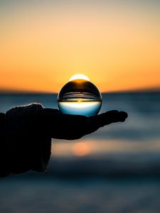 Preview wallpaper ball, hand, horizon, glass