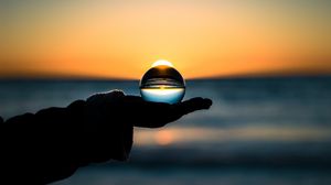 Preview wallpaper ball, hand, horizon, glass