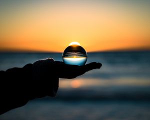 Preview wallpaper ball, hand, horizon, glass