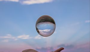 Preview wallpaper ball, hand, reflection, watch, sky