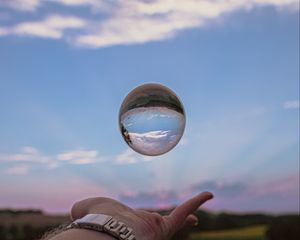 Preview wallpaper ball, hand, reflection, watch, sky