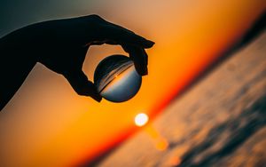 Preview wallpaper ball, hand, sunset