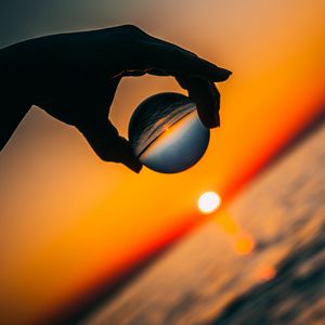 Preview wallpaper ball, hand, sunset