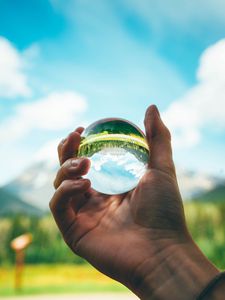 Preview wallpaper ball, reflection, hand, trees