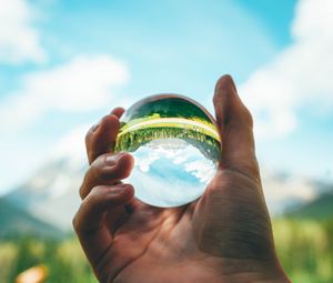 Preview wallpaper ball, reflection, hand, trees