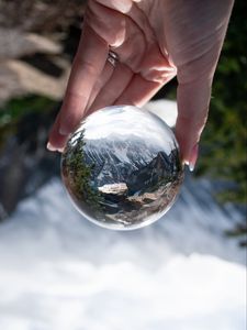 Preview wallpaper ball, reflection, mountains, nature, hand