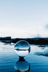 Preview wallpaper ball, reflection, water, ripples