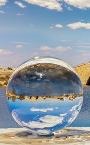 Preview wallpaper ball, river, bridge, clouds, reflection