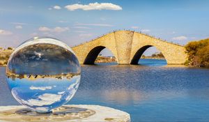 Preview wallpaper ball, river, bridge, clouds, reflection