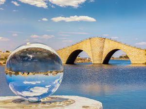 Preview wallpaper ball, river, bridge, clouds, reflection