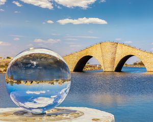 Preview wallpaper ball, river, bridge, clouds, reflection