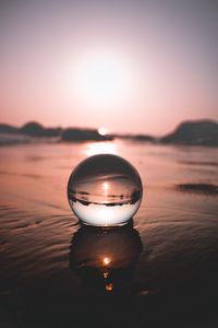 Preview wallpaper ball, water, reflection, distortion, focus