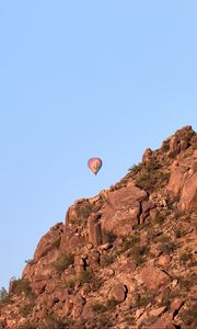 Preview wallpaper balloon, rock, mountains, sky